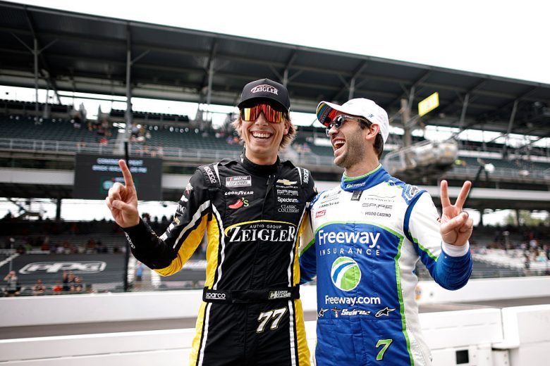 Carson Hocevar and Daniel Suárez celebrate.