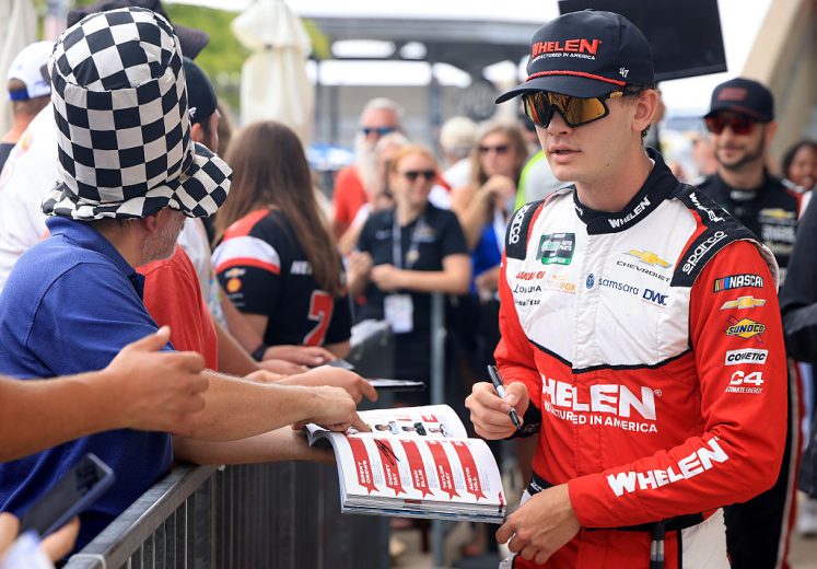 Jesse Love signs autographs.