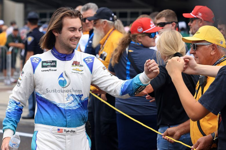 Kyle Sieg fist bumps fans.