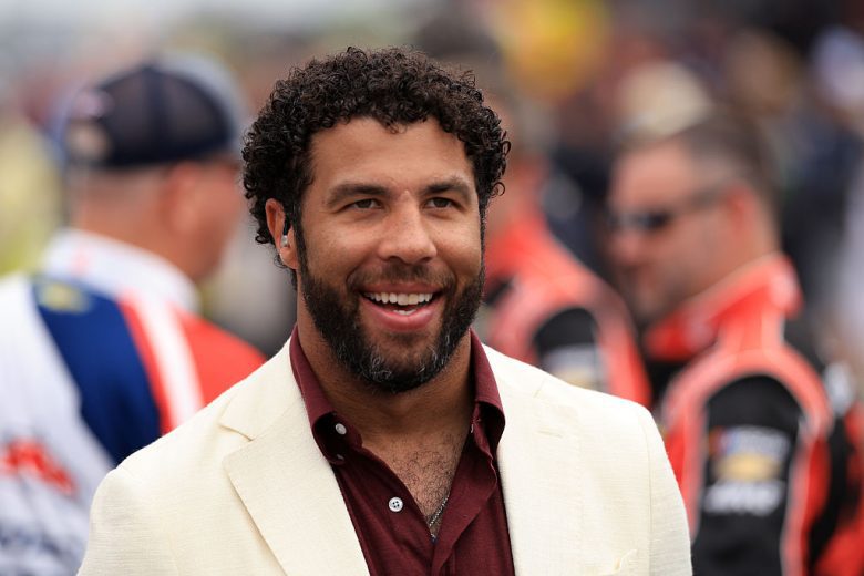 Bubba Wallace looks on.