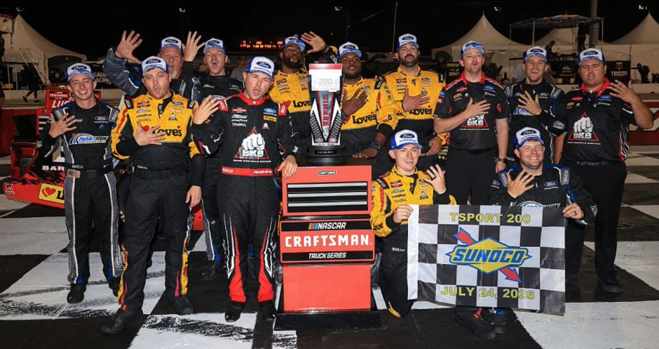 Layne Riggs celebrates in Victory Lane at IRP.