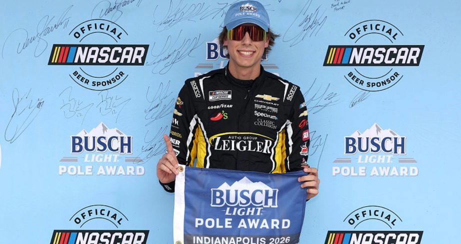 Carson Hocevar celebrates after winning the pole at Indianapolis.