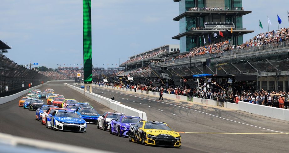 NASCAR Cup Series cars race at Indianapolis Motor Speedway.