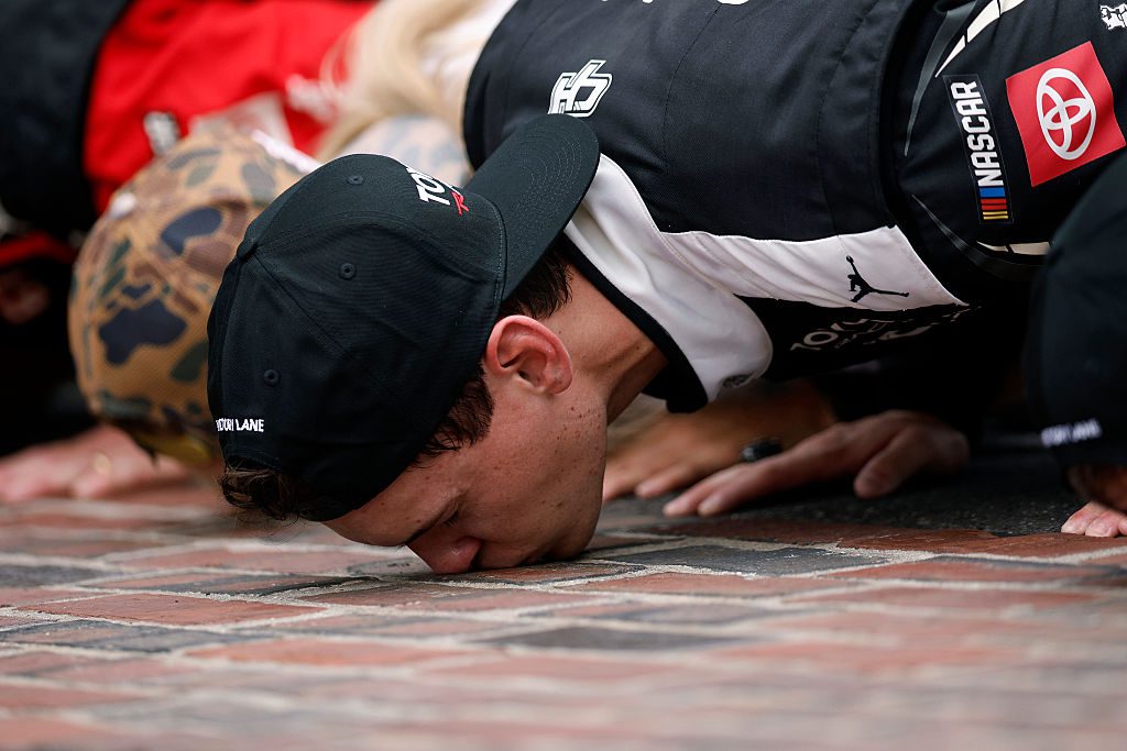 Corey Heim kisses the bricks.