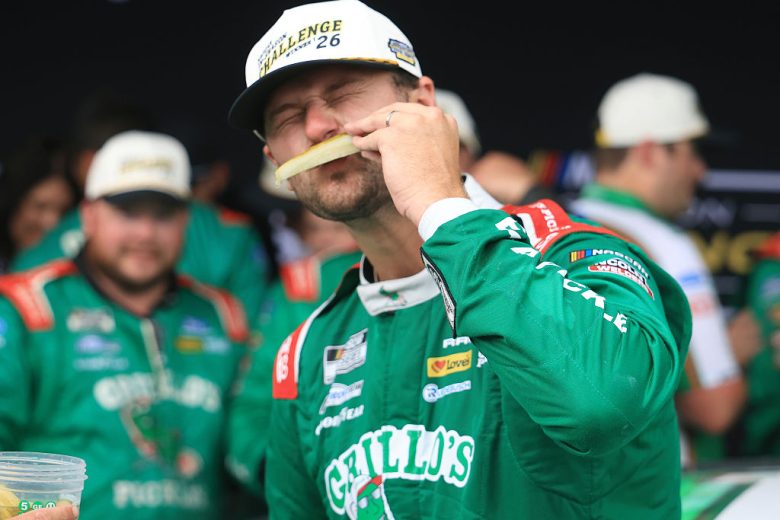 Todd Gilliland eats a pickle.
