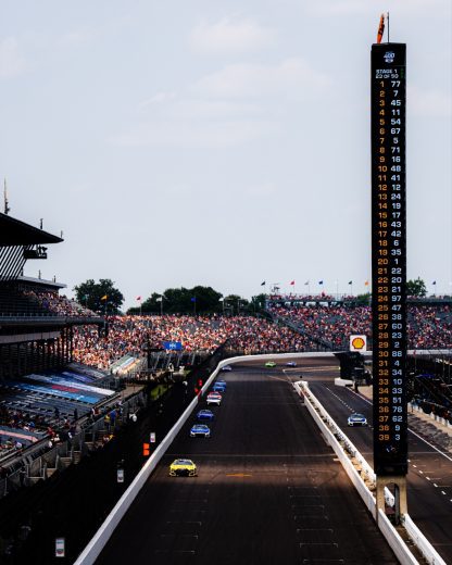 NASCAR Cup Series cars race at Indianapolis Motor Speedway.