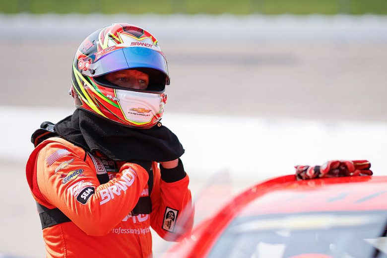 Justin Allgaier prepares to enter his car.