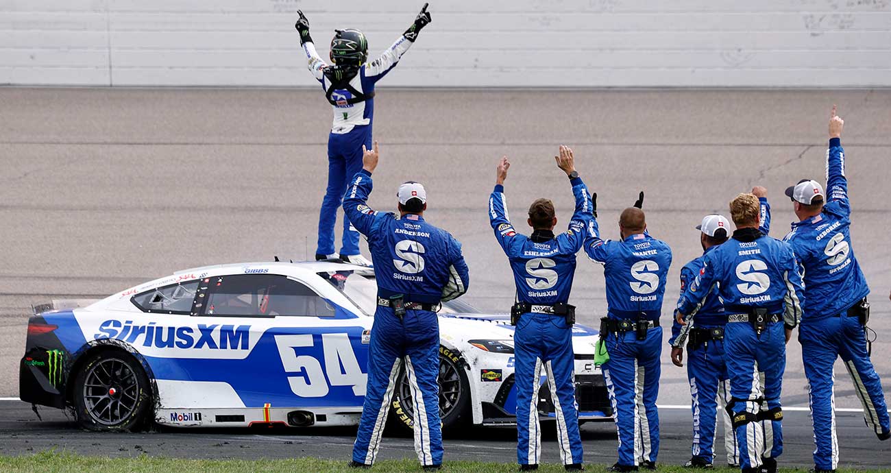 Ty Gibbs celebrates with his No. 54 team after victory at Iowa Speedway