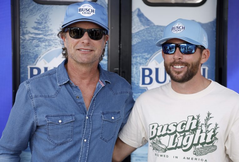 Ross Chastain takes a photo with Dierks Bentley at his hauler.