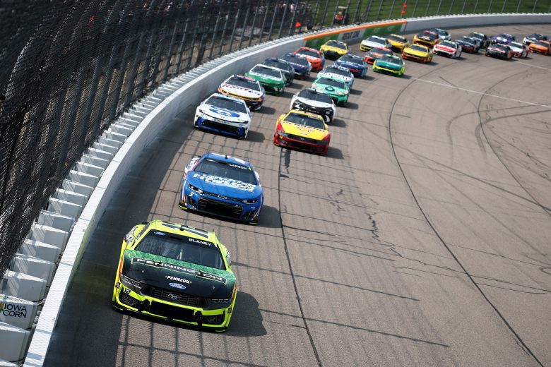 Cup Series cars drive on track at Iowa.