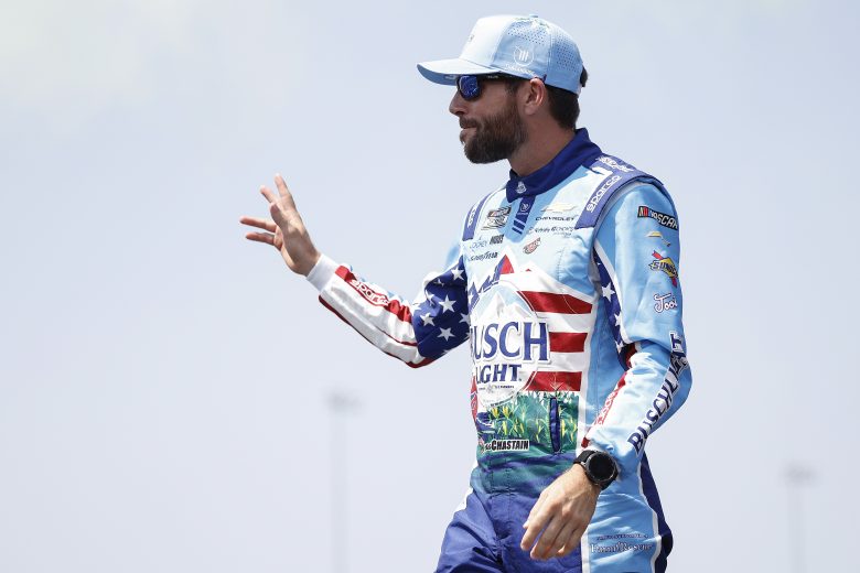 Ross Chastain waves to fans.