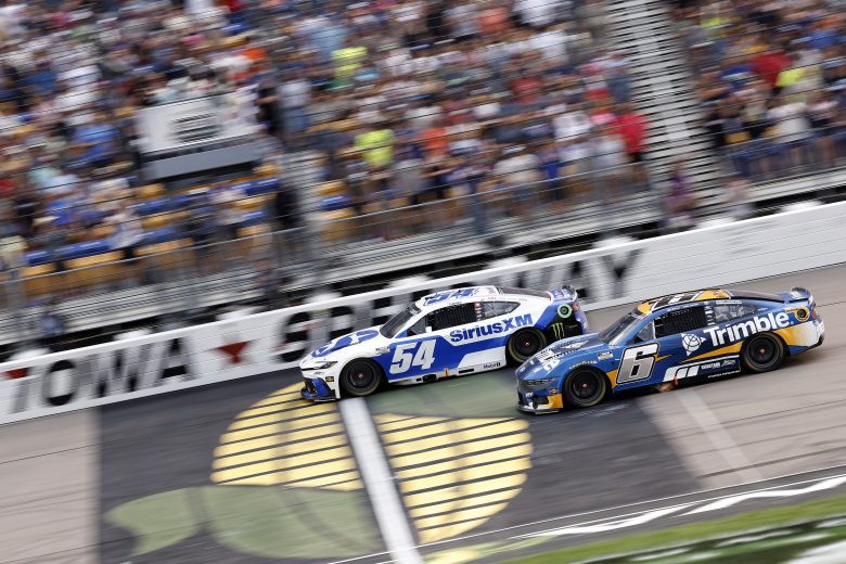 Ty Gibbs passes a car on track.
