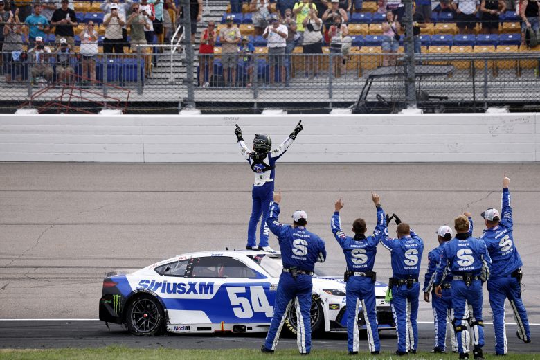 Ty Gibbs celebrates on top of his car.