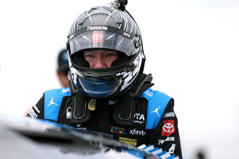 Tyler Reddick looks on.