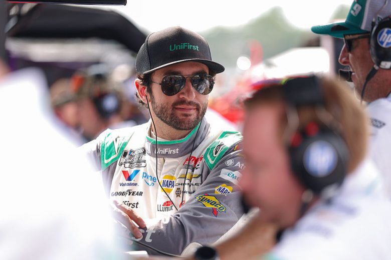 Chase Elliott looks on.