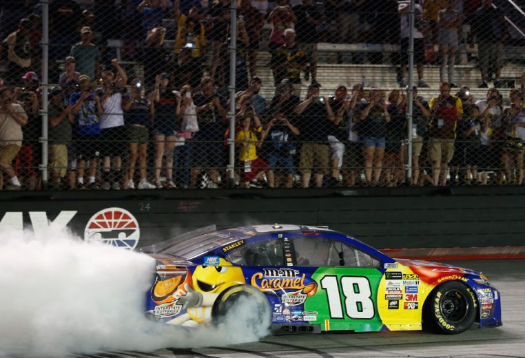 Kyle Busch does a celebratory burnout in the No. 18 Joe Gibbs Racing Toyota at Bristol Motor Speedway.