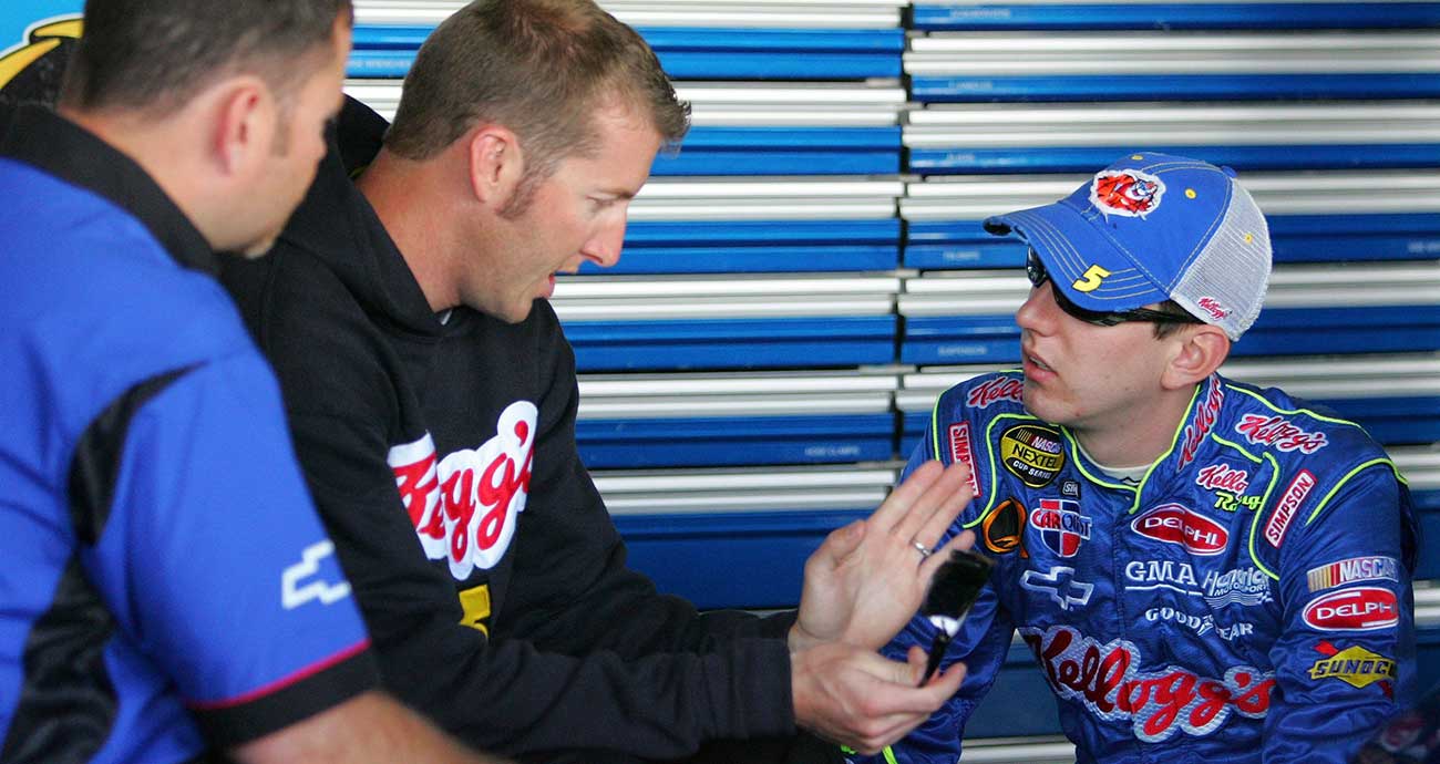 Kyle Busch and crew chief Alan Gustafson talk it over in the garage during the 2006 season
