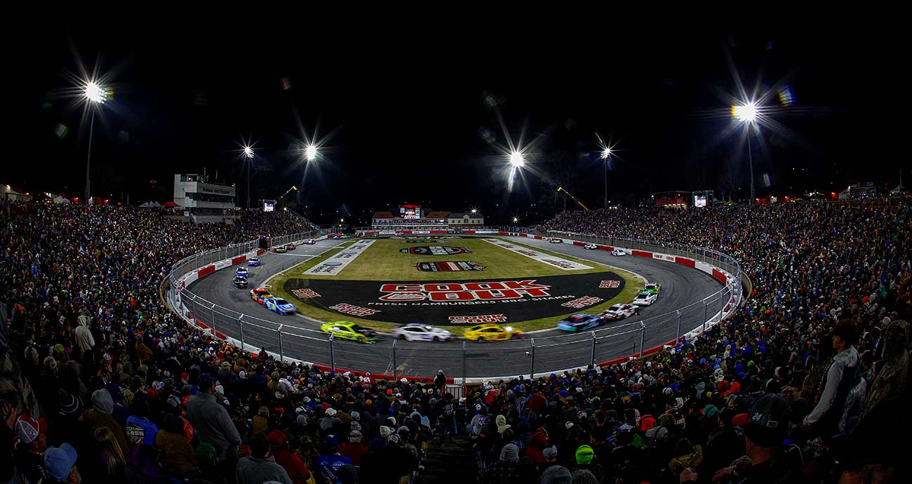 The NASCAR Cup Series rolls through the south turn at Bowman Gray Stadium in the first Cook Out Clash in 2025