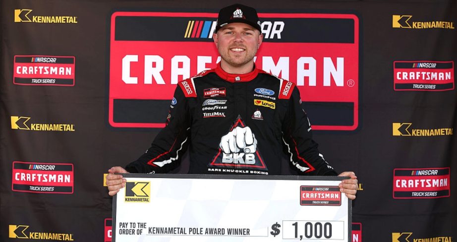 Layne Riggs celebrates after winning the pole at New Hampshire.