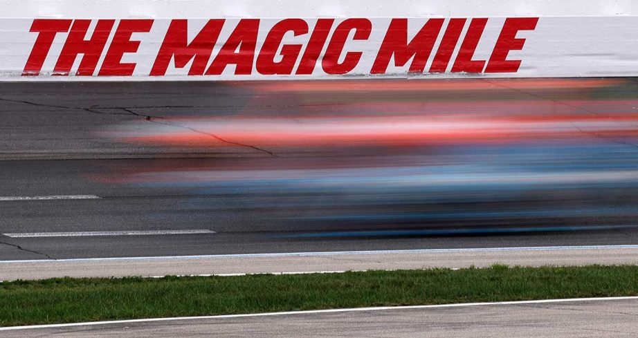 Craftsman Truck Series racers flash by the outside retaining wall at New Hampshire Motor Speedway
