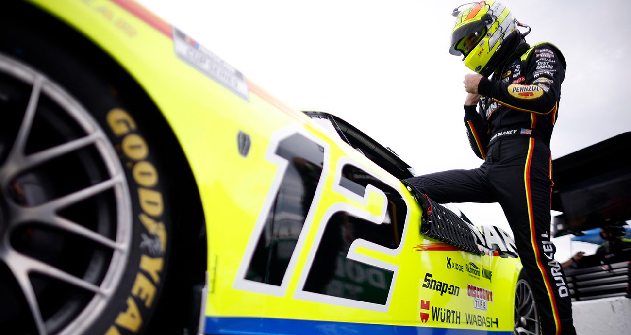 ryan blaney climbs into his no. 12 car