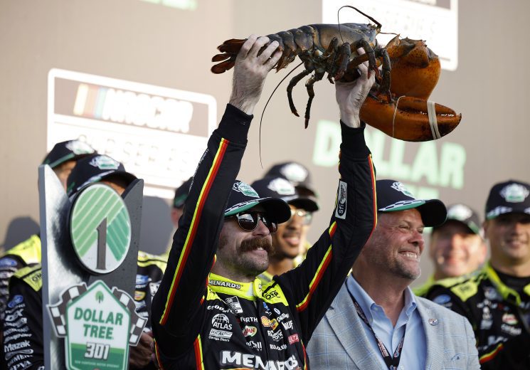 Ryan Blaney hoists a lobster.