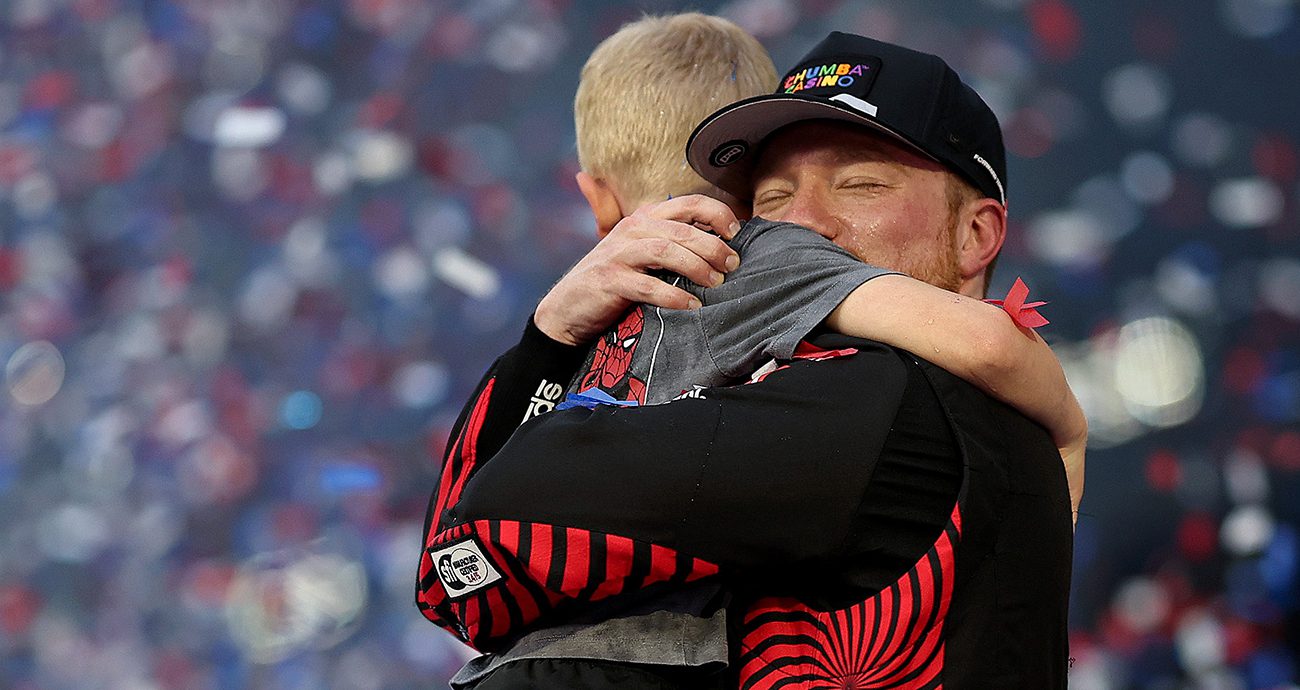 tyler reddick hugs and celebrates with his son
