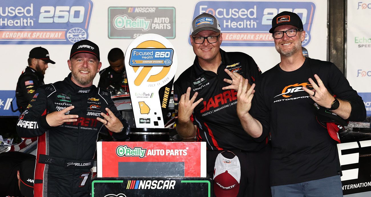 Justin Allgaier (L), Andrew Overstreet (C) and Dale Earnhardt Jr. (R) pose for a photo in Victory Lane at EchoPark Speedway.