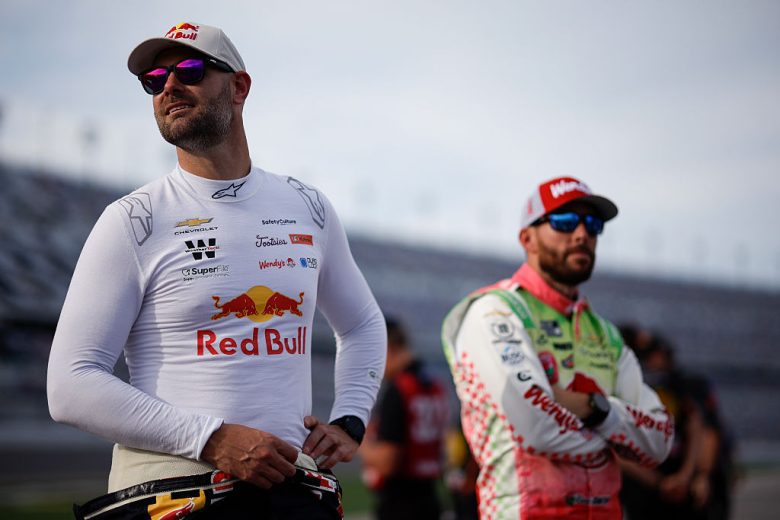 Shane van Gisbergen and Ross Chastain look on.