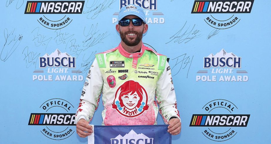 Ross Chastain celebrates after winning the pole.
