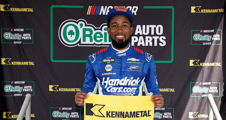 Rajah Caruth celebrates after winning the pole at Daytona.