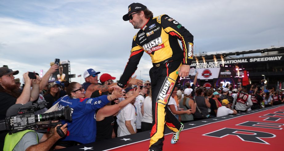 Noah Gragson greets fans on stage during driver introductions on Aug. 29, 2026 at Daytona International Speedway.