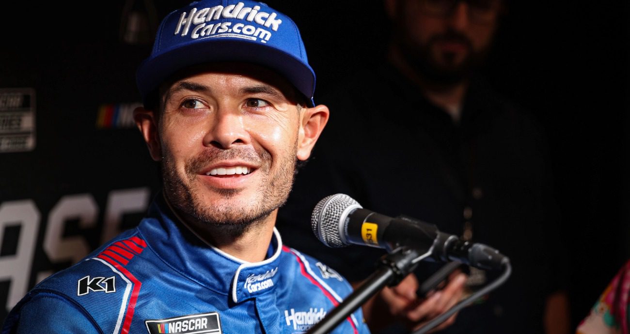 Kyle Larson looks on and smiles during media day.