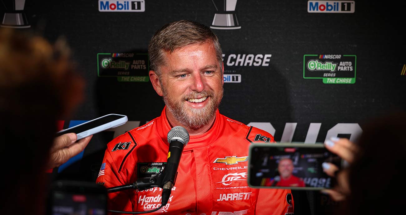 Justin Allgaier smiles while fielding questions during Chase Media Day at the Charlotte Convention Center