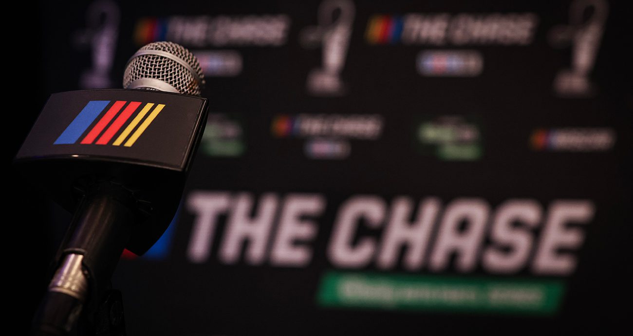 a nascar microphone in front of the chase logo branding