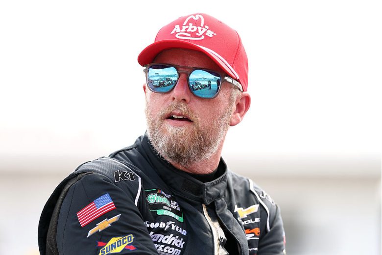 Justin Allgaier looks on.