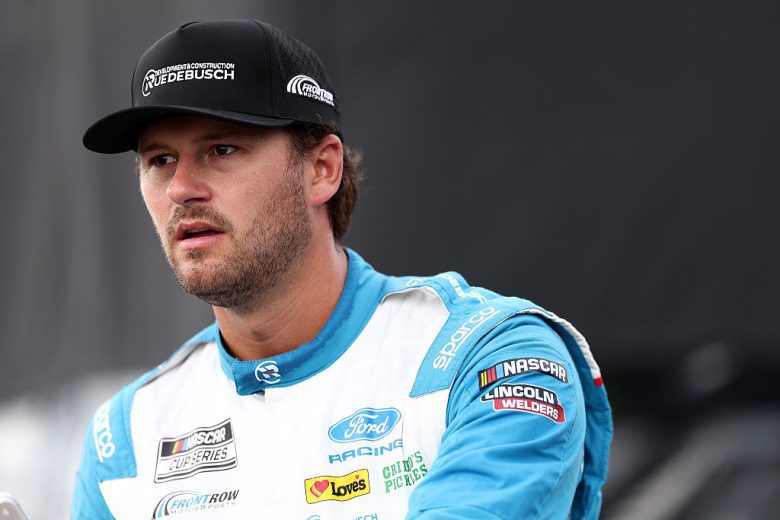Todd Gilliland looks on.