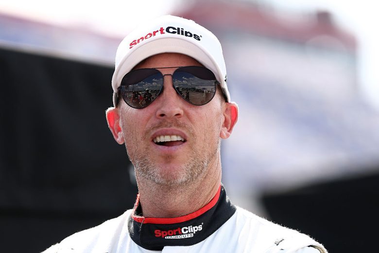 Denny Hamlin looks on.