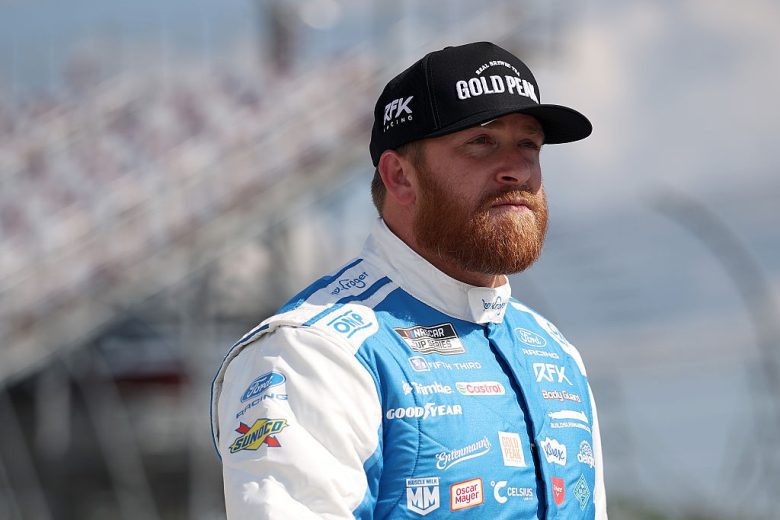 Chris Buescher looks on.