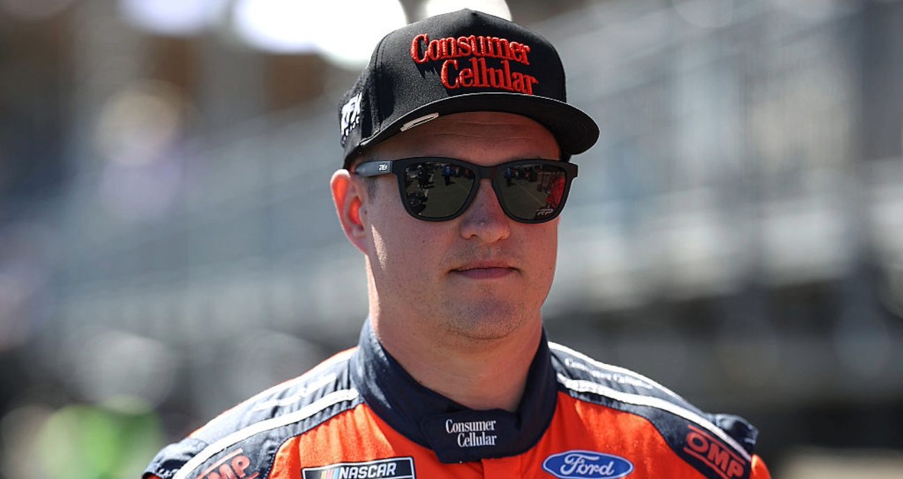 Ryan Preece looks on.