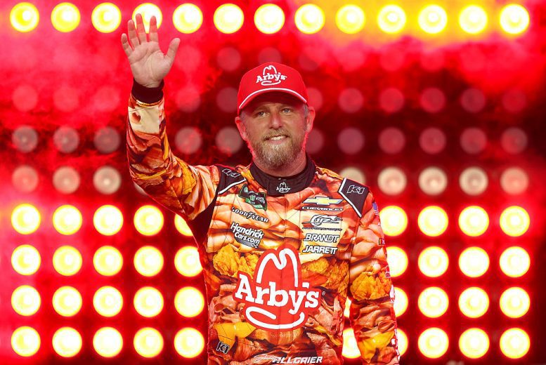 Justin Allgaier waves to fans.