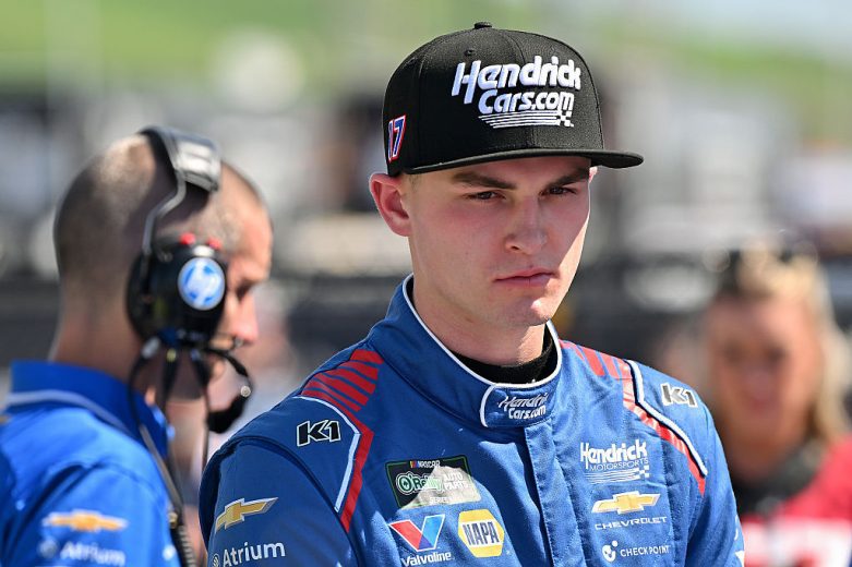 Corey Day looks on.
