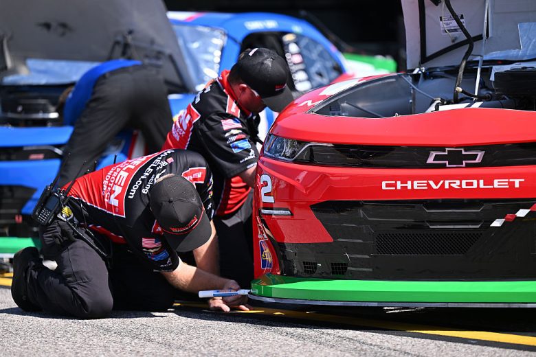 Crew members work on Jesse Love's car.