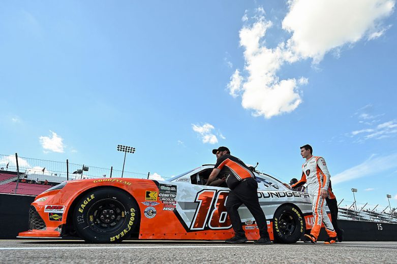 William Sawalich and his crew push his car down pit road at Gateway.
