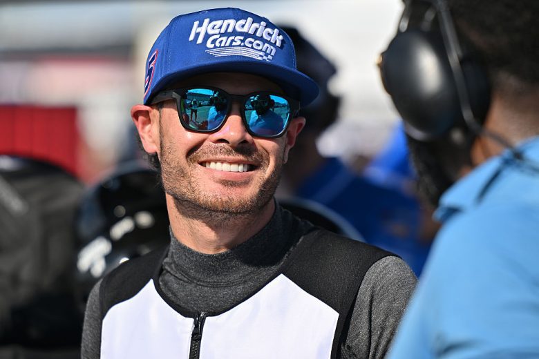 Kyle Larson looks on.
