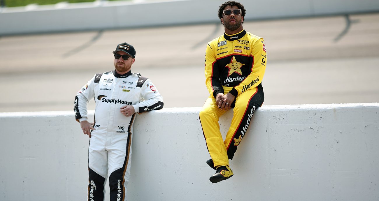 Bubba Wallace, driver of the No. 23 Hardee's Toyota, (R) and Tyler Reddick, driver of the No. 45 SupplyHouse Toyota, look on during practice for the NASCAR Cup Series Iowa Corn 350 Powered by Ethanol at Iowa Speedway on Aug. 8, 2026 in Newton, Iowa.
