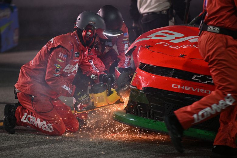 Justin Allgaier's crew works on his damaged car.