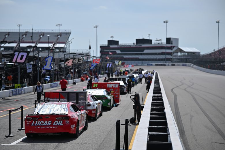 NASCAR Cars lined up on pit road for pre-race.
