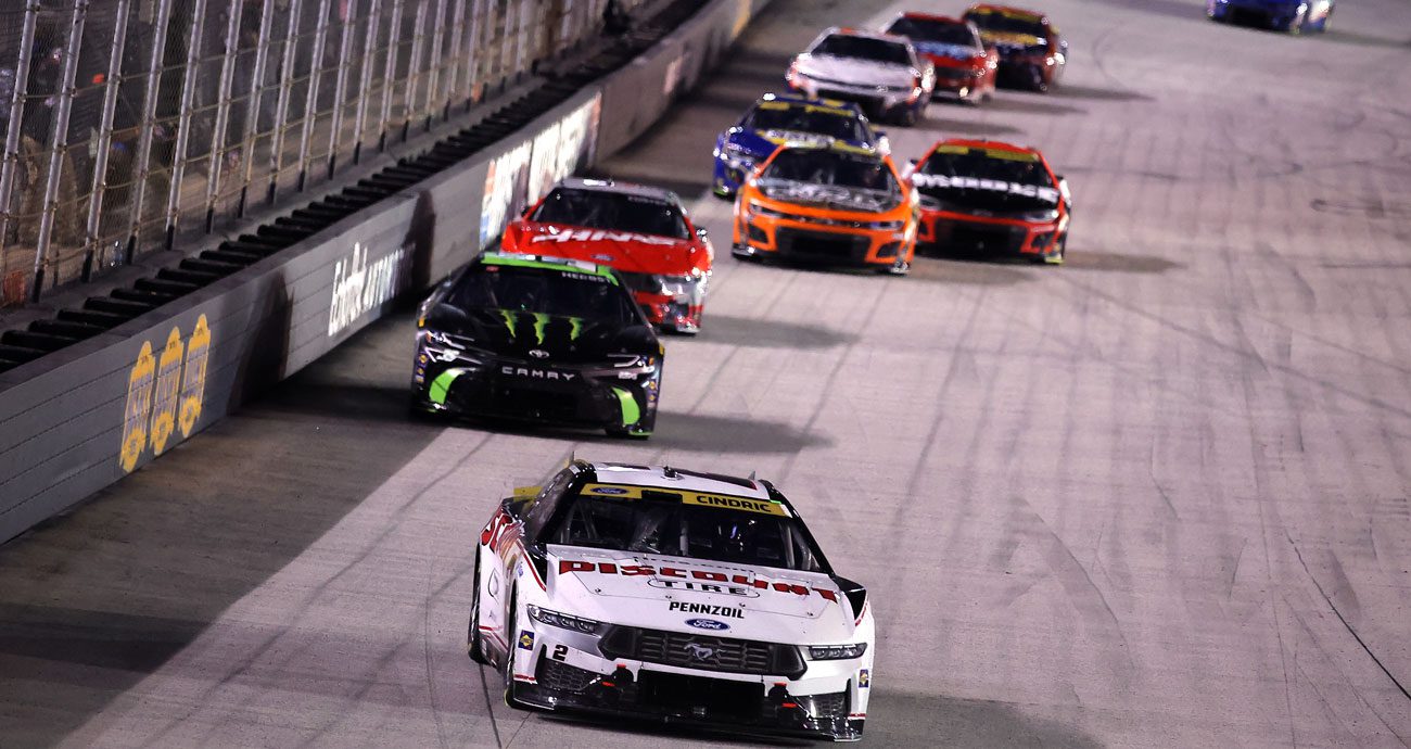NASCAR Cup Series cars race at Bristol Motor Speedway.