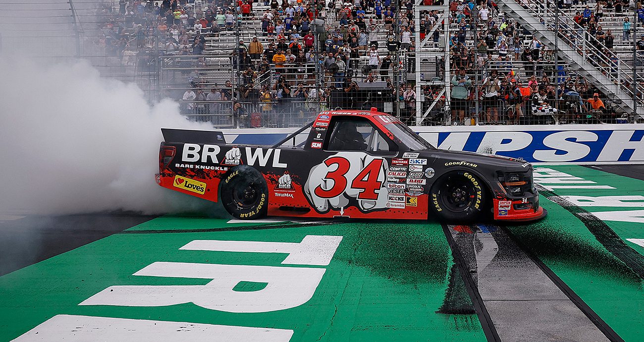 Layne Riggs celebrates a Craftsman Truck Series win at New Hampshire Motor Speedway.